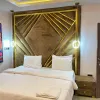 Large Bedroom - fitted with king size bed, smart Tv that comes with DSTv full package and netflix, Air conditioner, luxury bathroom, and luxury decorations