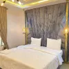 Large Bedroom - fitted with king size bed, smart Tv that comes with DSTv full package and netflix, Air conditioner, luxury bathroom, and luxury decorations