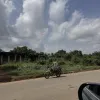 1 Acre of Land Fenced directly With 4 Shops